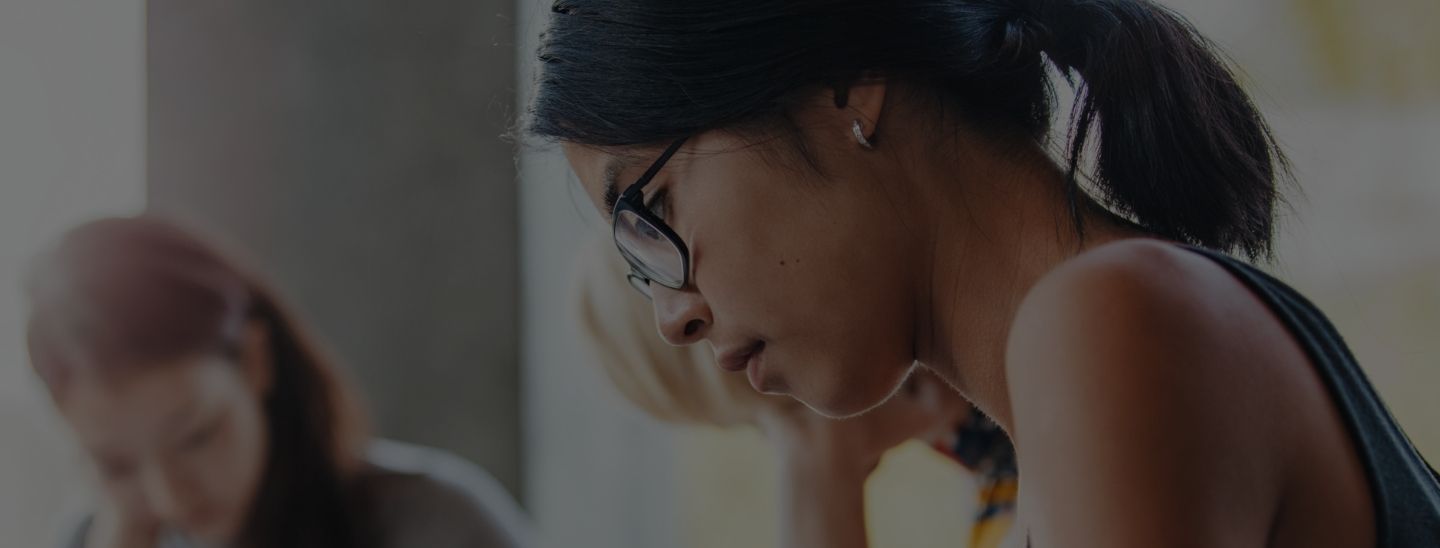 Female student studying in classroom