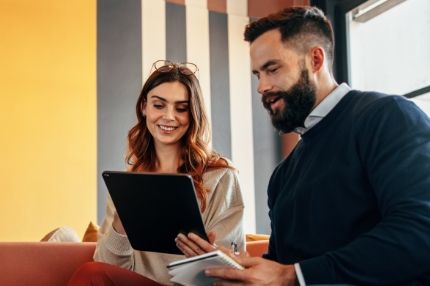 Looking at tablet in the lobby