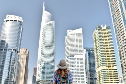 Woman admires dubai skyline