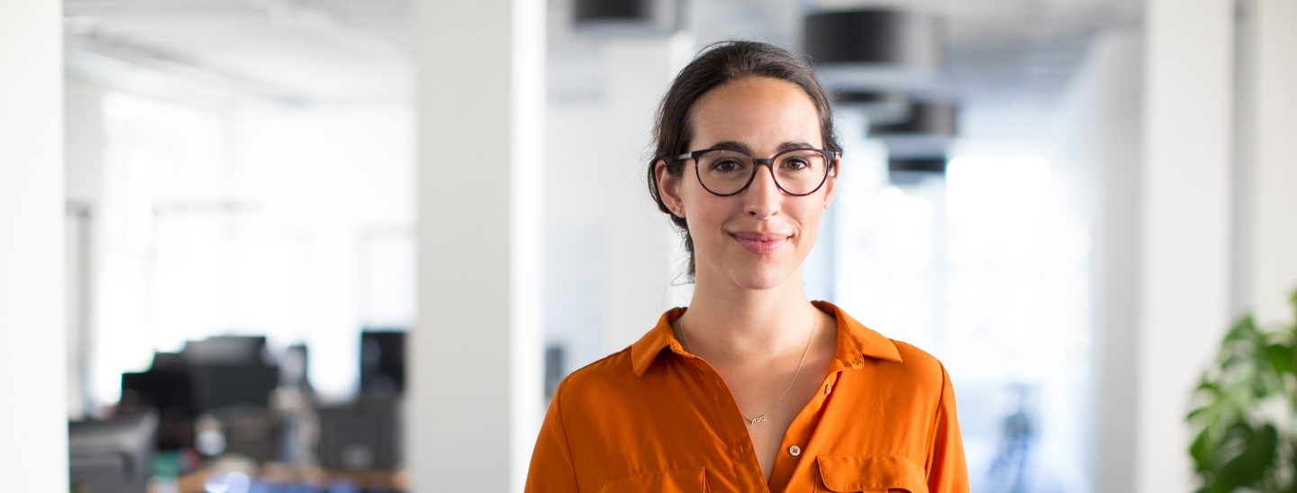 Woman holding paper in office