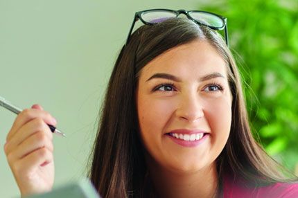 Woman studying working with pen
